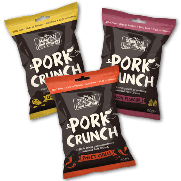 Packets of Scratch My Pork on table with pork rind